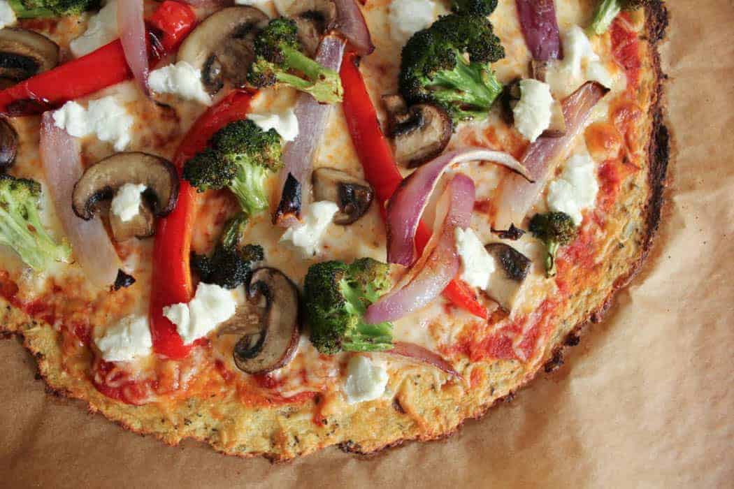 Cauliflower Pizza Crust With Roasted Vegetables and Goat Cheese
